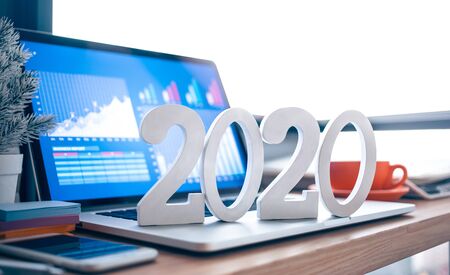 2020, smart goal concepts with mock up text number on computer laptop on desk table and window...