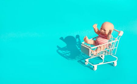 Baby,kid mockup in stroller cart on blue color background.Growing concepts ideasの写真素材