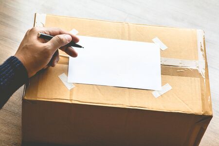 Donation concepts with person writing on packing box.giving and sharing with human.second hand or...