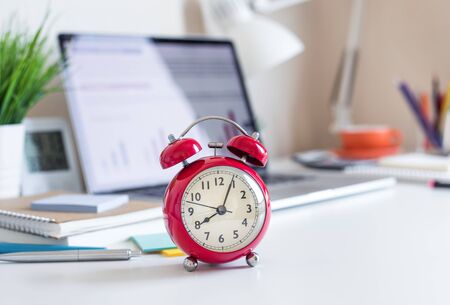 Business concepts with red clock  on desk.For investment analysis,waiting to sucess ideas .time and working dayの写真素材