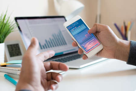 Big data or digital marketing or concepts with young person watching data graph on smartphone and...