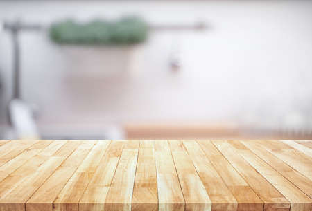 Wood table top on blur kitchen counter (room)background.For montage product display or design key...