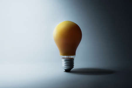 Glowing light bulb in dark.creativity inspiration concept ideasの写真素材