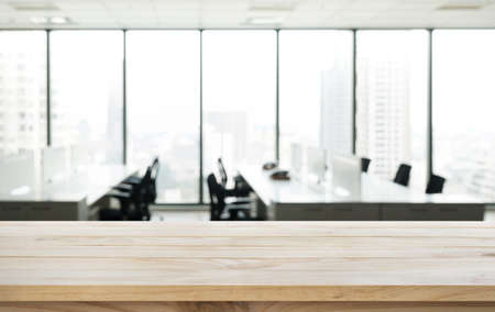 Empty wood table with blur room office and window city view background.For montage product display or design key visual layout.の写真素材