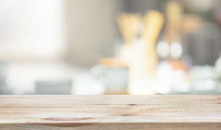 Wood table top on blur kitchen counter background.For montage product display or design key visual...