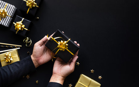Merry christmas and new year celebration concepts with person hand holding gift box and ornament in...