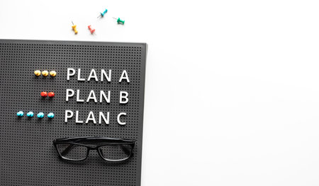 Plan a,b,c and direction concepts with text on desk table.Business management.meeting and...