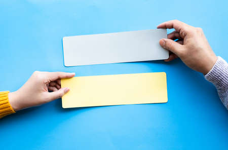 Conversation talk or word of mouth concepts with male hand holding blank paper.copy spaceの写真素材