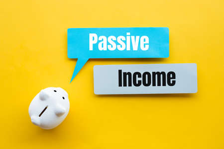 Passive income and investment financial concepts with text and piggy bank.no peopleの写真素材