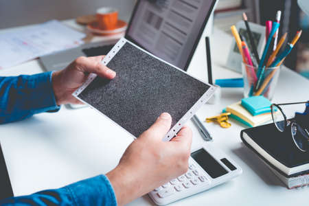 Businessman holding document envelope on desk table.business information.