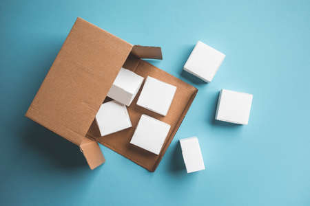 Top view of small box on blue background.delivery or online shopping.buy and sell conceptsの写真素材