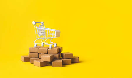 Business ecommerce or online shopping concepts with product box order and trolley.marketplace and transportation service.copy spaceの写真素材