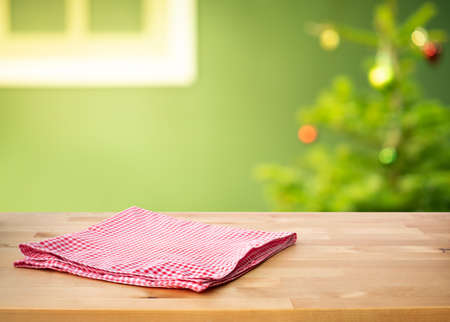 Red checked tablecloth on wood with christmas tree,decoration backgroundの写真素材