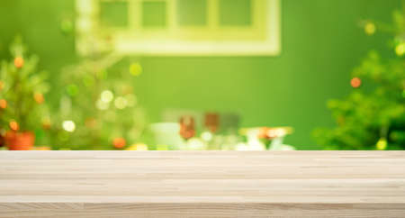 Selective focus.Empty wood table top with blur abstract light bokeh of christmas tree,decoration...