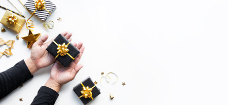 Merry christmas and new year celebration concepts with person hand holding gift box and ornament in...