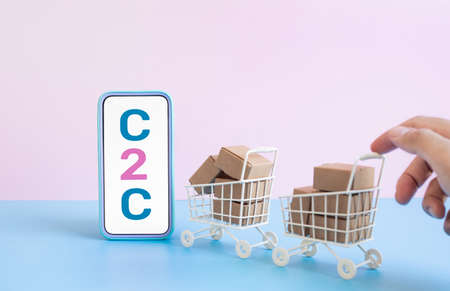 Business ecommerce or online shopping concepts with c2c and smartphone and product box order in trolley.marketplace and transportation service.copy spaceの写真素材