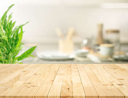 Selective focus.Wood table top on blur kitchen counter background.For montage product display or design key visual layout.の写真素材