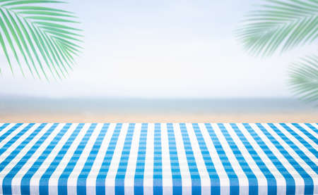 Checkered tablecloth texture with sea view background.For montage product display or design key...