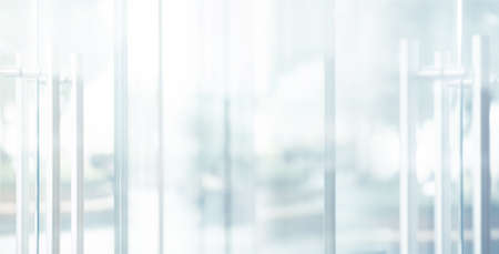 Blurred images of glass wall with city town background.modern abstract window for banner designの写真素材