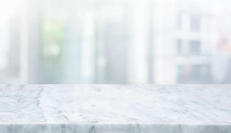 Selective focus.Marble table top on blur abstract window glass background.For montage product displayの写真素材