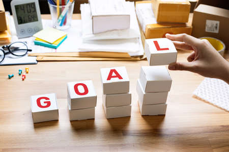 Business goal and planning process concepts with goal text on box on desk.how to success