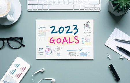 2023,business goals with text on notepad and office accessories.management,Inspiration to success