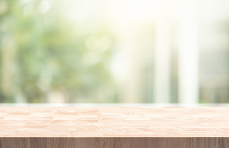 Selective focus.Wood table counter on blur green garden garden from window view background.for concepts designの写真素材