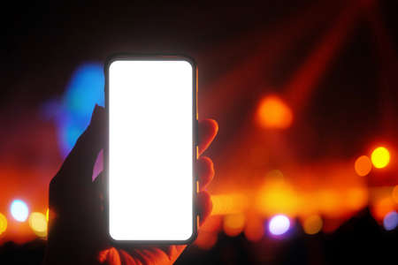 hand holding smart phone record the music showの写真素材