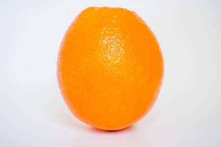 orange standing on the tableの写真素材