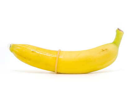 Transparent condom placed on banana. concpt of sexual protectionの写真素材