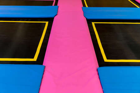 Empty trampoline waiting for children, lean placeの写真素材