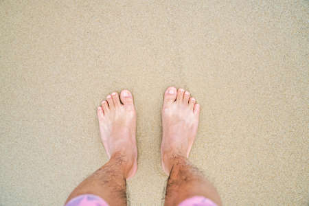 barefoot on the yellow clean beachの写真素材