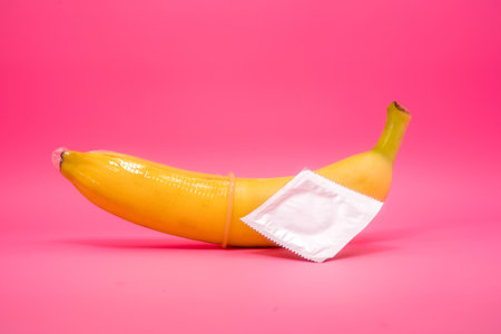 Transparent condom placed on banana. concpt of sexual protectionの写真素材