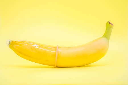 Transparent condom placed on banana. concpt of sexual protectionの写真素材