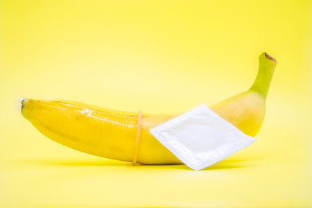 Transparent condom placed on banana. concpt of sexual protectionの写真素材