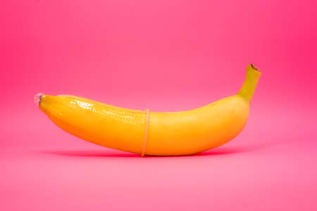 Transparent condom placed on banana. concpt of sexual protectionの写真素材