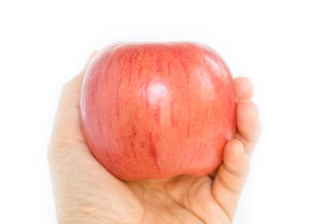 hand holding apple pie with heart shape, concept of loveの写真素材