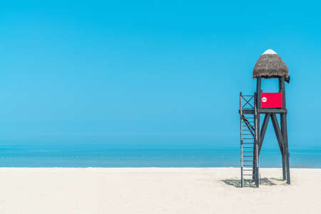 Lifeguard tower on beach, palm roof,chinaの写真素材