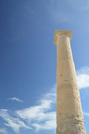 Ancient column set against a blue skyの写真素材