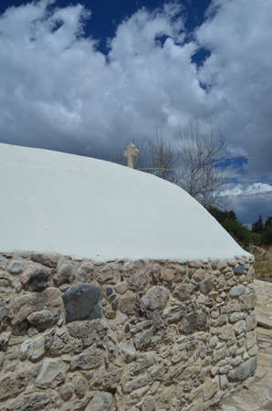 Medieval stone church with cloudy blue sky in the backgroundの写真素材