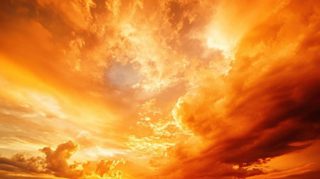 A blazing orange sky at dusk, with fiery clouds lighting up the horizon, resembling a natural inferno in the sky -の素材