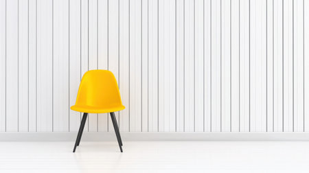 A vibrant yellow chair stands alone in a modern minimalist space, showcasing clean lines and bright colors, perfect for interior decor inspiration.の素材