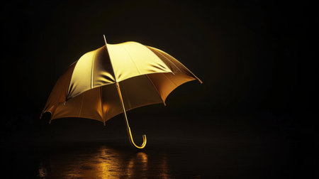 Golden umbrella shielding business assets, representing comprehensive insurance coverage. Copy space for insurance details.の素材