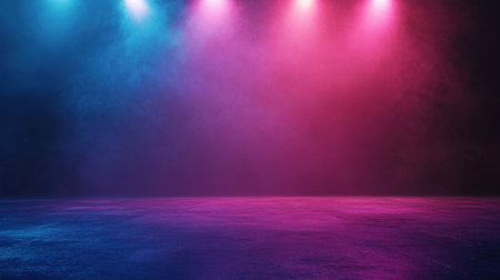 Colorful lights beam onto an empty stage, contrasting with the dark background and creating a lively, dramatic sceneの素材