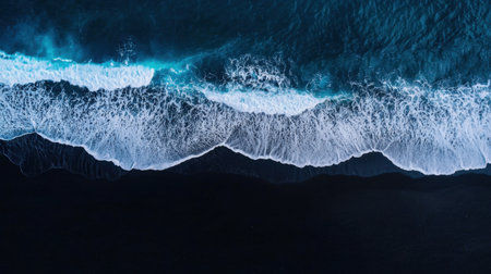 This stunning aerial photograph captures the serene beauty of turquoise waves breaking against a dark sandy shoreline, highlighting nature's breathtaking patterns.の素材