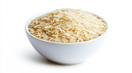 Basmati rice in a simple white bowl, isolated on a white background, emphasizing the clean, fluffy grainsの素材