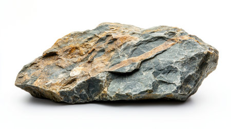A rough rock with natural edges, isolated on a white background, highlighting its earthy texture and formの素材