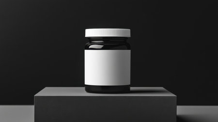 A stylish black jar presented on a dark platform, featuring a blank label. Ideal for showcasing product designs, branding concepts, or minimalist aesthetics.の素材