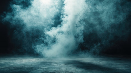 Smoke rising from a concrete floor in a dimly lit, moody studio setting, evoking a mystical and ethereal mood.の素材