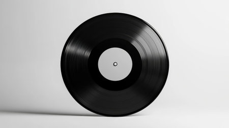 A black vinyl record centered on a white background, ideal for showcasing album artwork or graphic design mockups.の素材